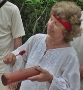 Playing wooden tube at ceremony, Lol Be, Yucatan