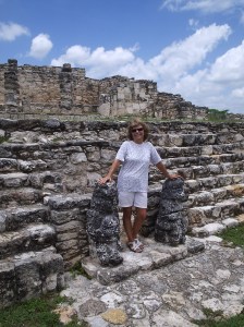 Standing between two aluxes (Maya fairy people) at Mayapan