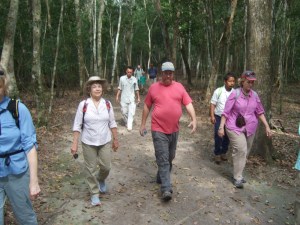 Walking on sacbe at El Mirador with archeologist Ed Barnhart (red shirt)