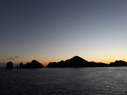 Sunset behind island mountains